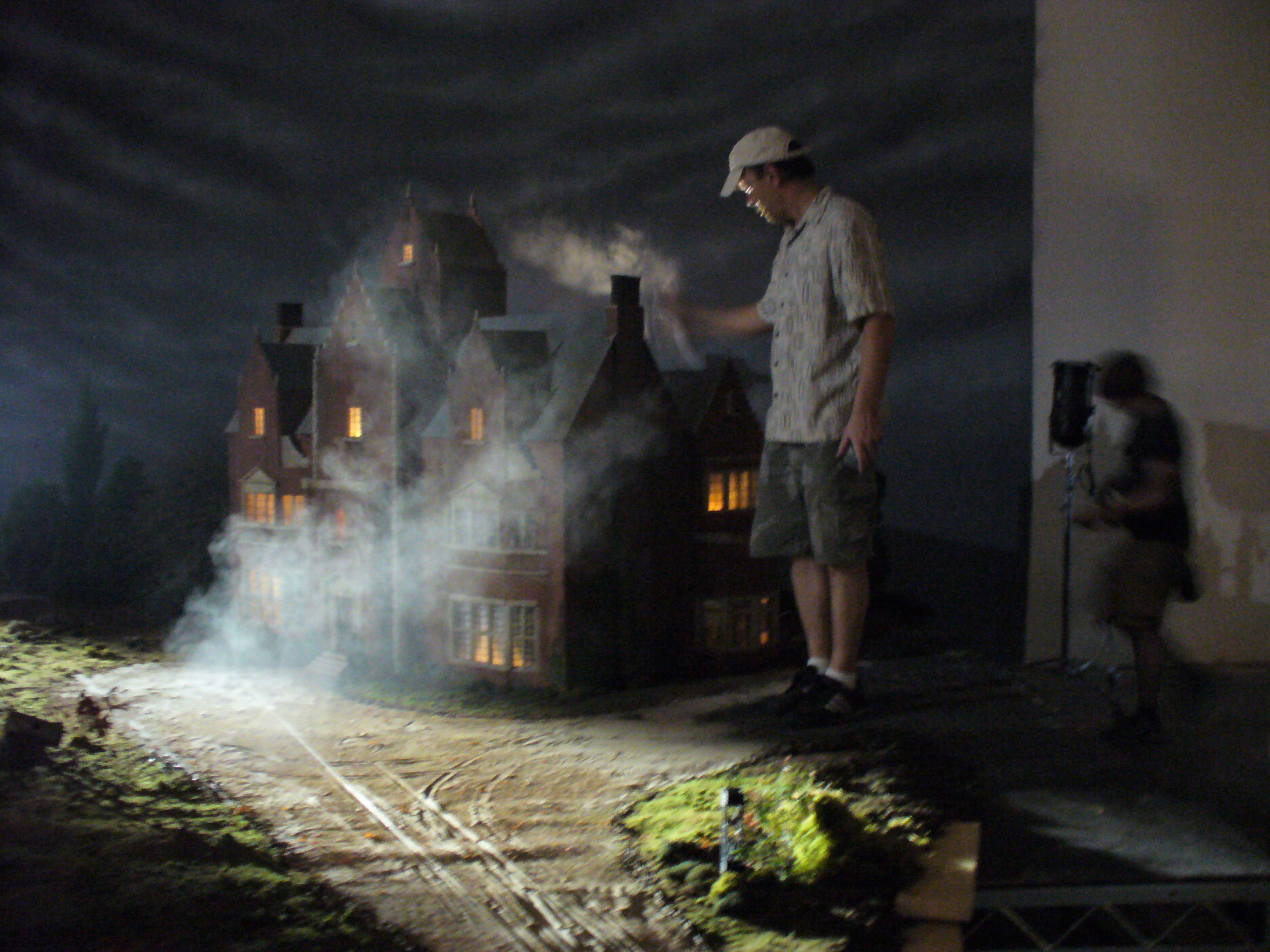 Production designer Anton Tremblay with his  old dark house model for Dark and Stormy Night